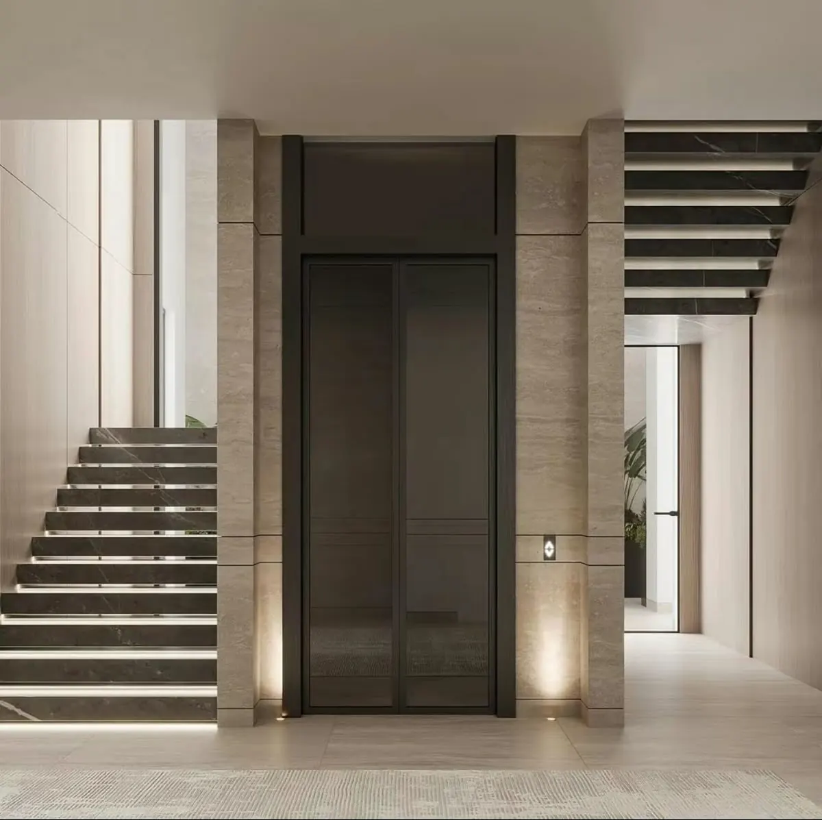 Dark flush lift doors integrated between illuminated stone stairs in a modern neutral villa lobby